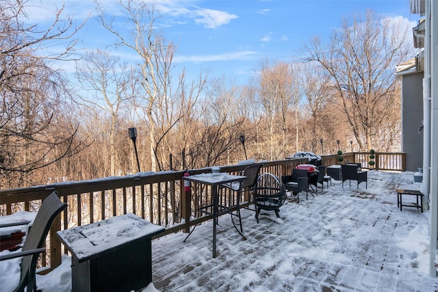 view of snow covered deck