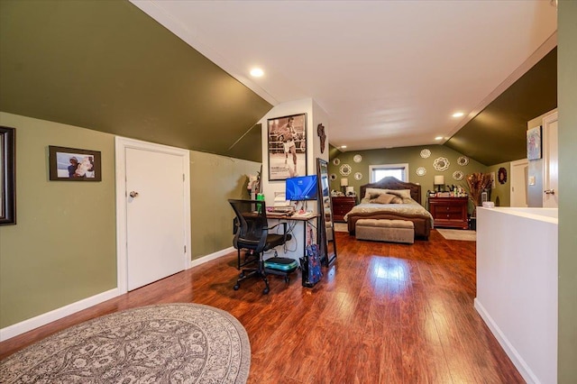 bedroom featuring wood-type flooring and lofted ceiling