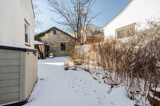 view of yard layered in snow