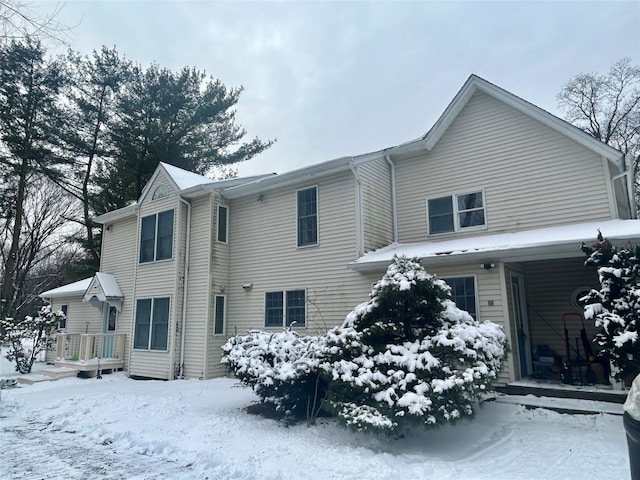 view of snow covered house