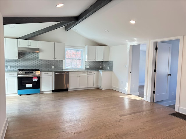 kitchen featuring backsplash, white cabinetry, appliances with stainless steel finishes, and lofted ceiling with beams