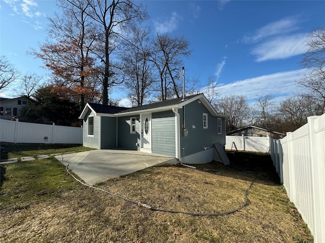 rear view of property featuring a patio area and a yard