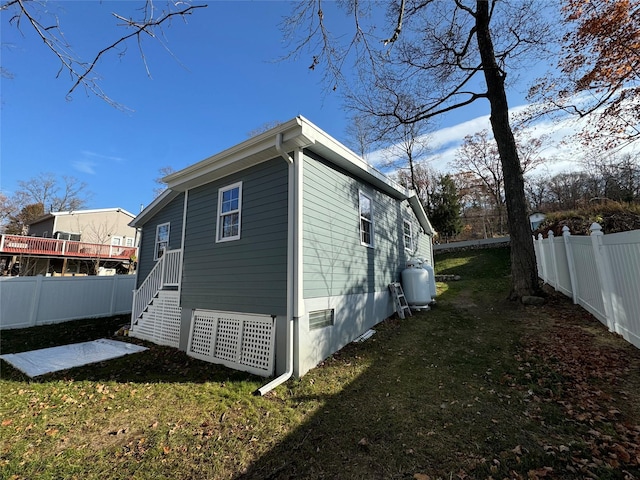 view of home's exterior featuring a yard