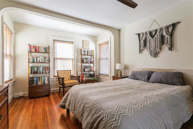 bedroom featuring dark hardwood / wood-style flooring and ceiling fan