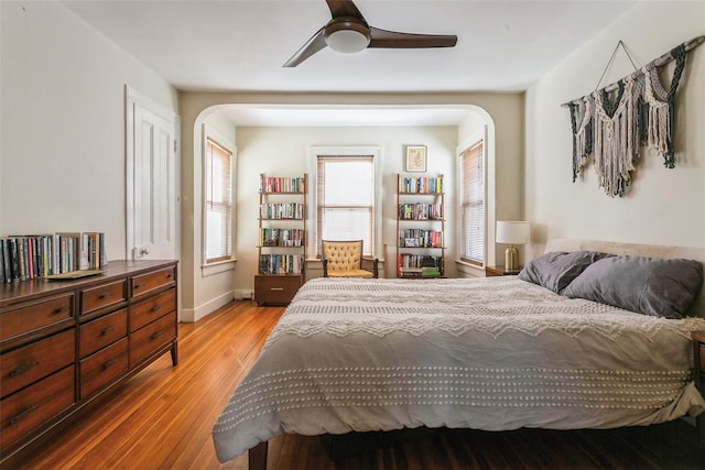 bedroom with hardwood / wood-style floors and ceiling fan