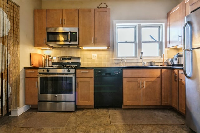 kitchen featuring stainless steel appliances, sink, and backsplash