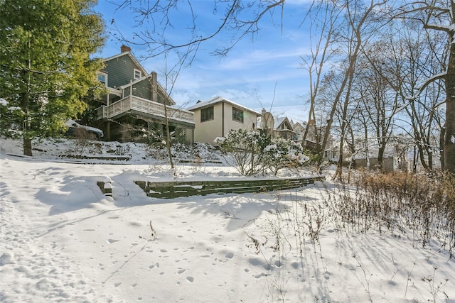 view of yard covered in snow