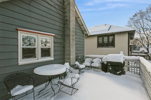 view of snow covered patio