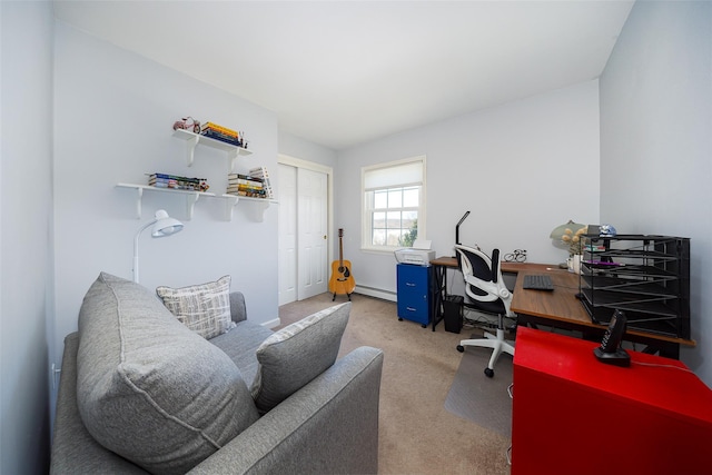 home office with a baseboard heating unit and light carpet