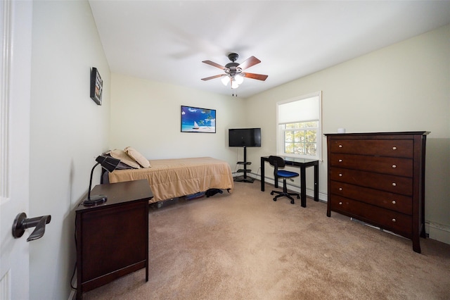 bedroom with a ceiling fan and carpet flooring