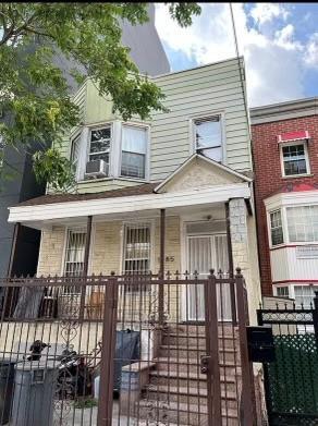 townhome / multi-family property with covered porch