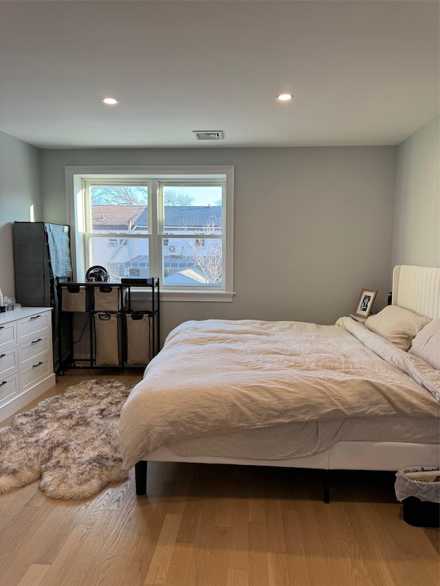 bedroom with light wood-type flooring