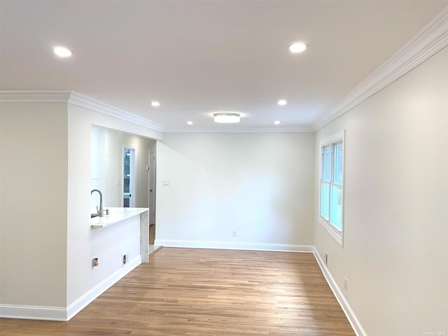 interior space featuring hardwood / wood-style floors and crown molding