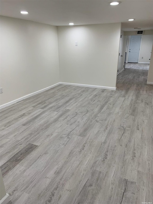 spare room with light wood-type flooring