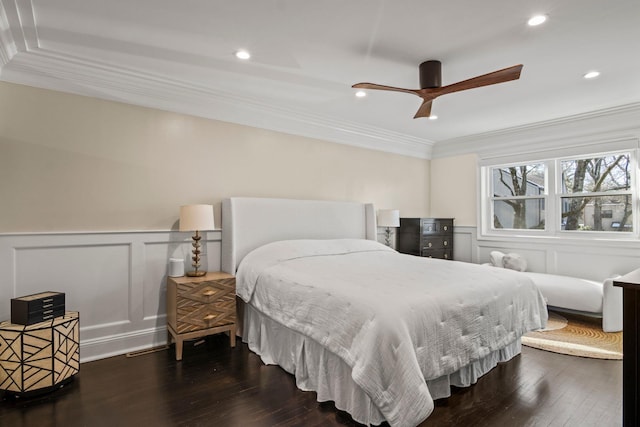 bedroom featuring ornamental molding, dark wood-type flooring, and ceiling fan