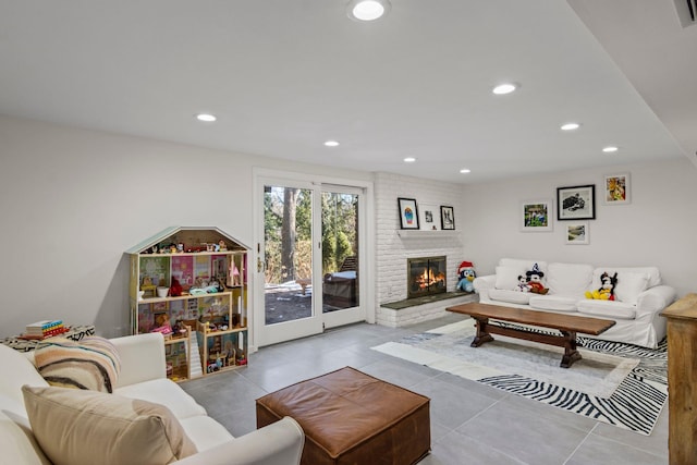 living room with light tile patterned floors and a fireplace