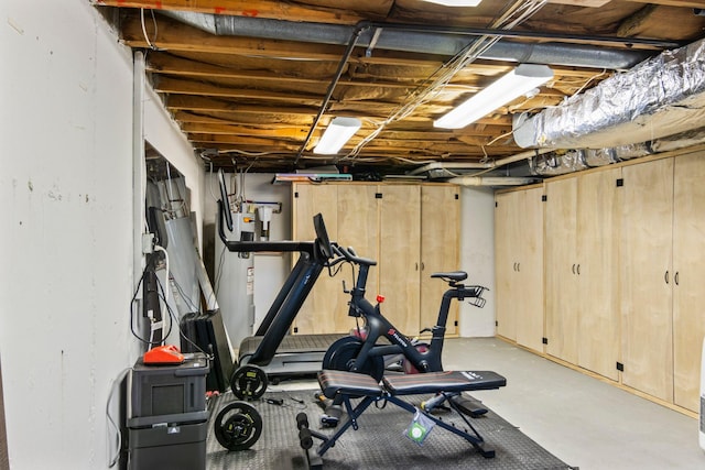 exercise area featuring electric water heater