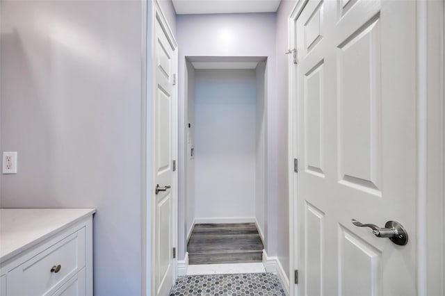 bathroom with tile patterned flooring, baseboards, and vanity