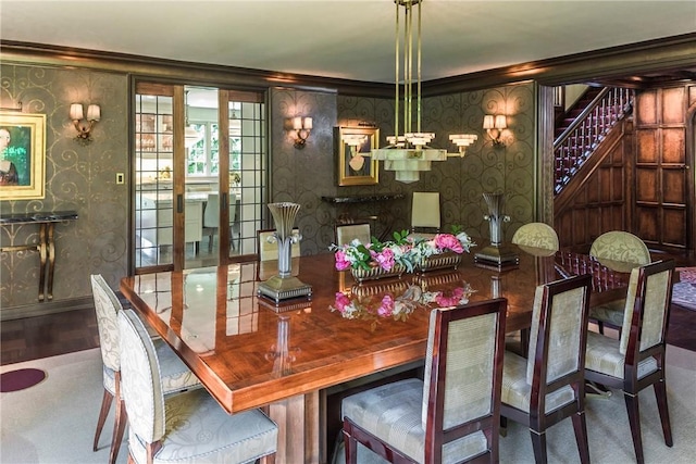 42 Masterton Rd, Bronxville, NY 10708 - dining space with ornamental molding, wood finished floors, wallpapered walls, baseboards, and stairs