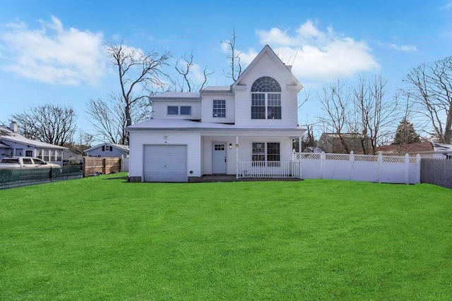 rear view of house featuring a yard and covered porch