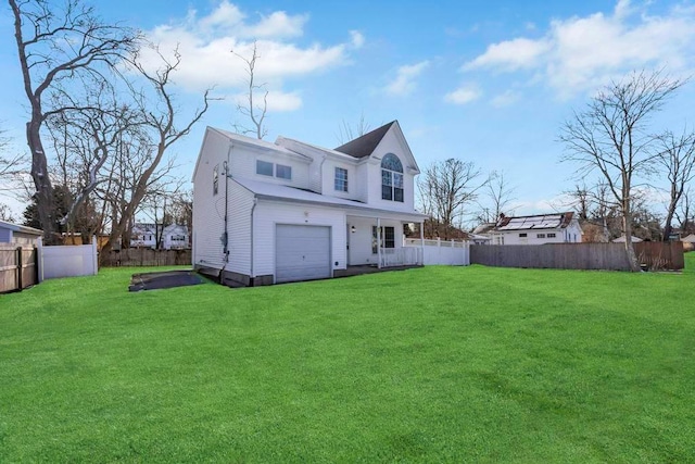 back of house featuring a lawn