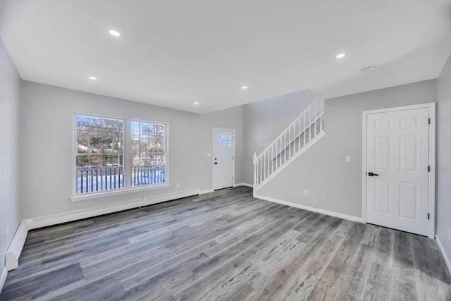 interior space featuring hardwood / wood-style floors and baseboard heating