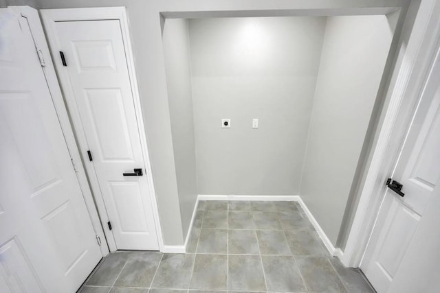 washroom featuring light tile patterned flooring and hookup for an electric dryer