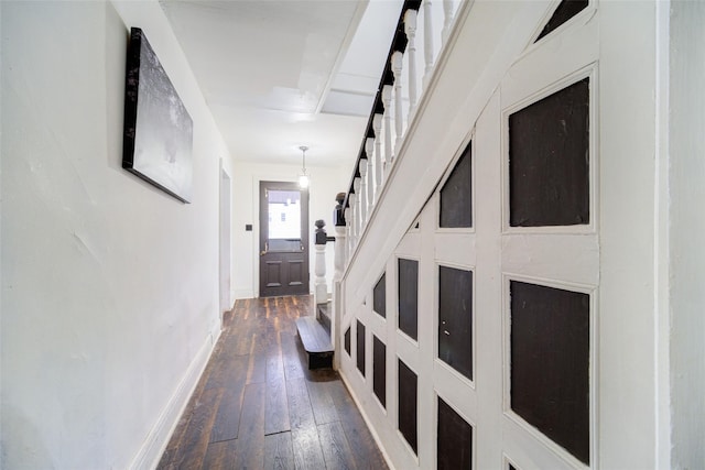 hallway with dark wood-type flooring