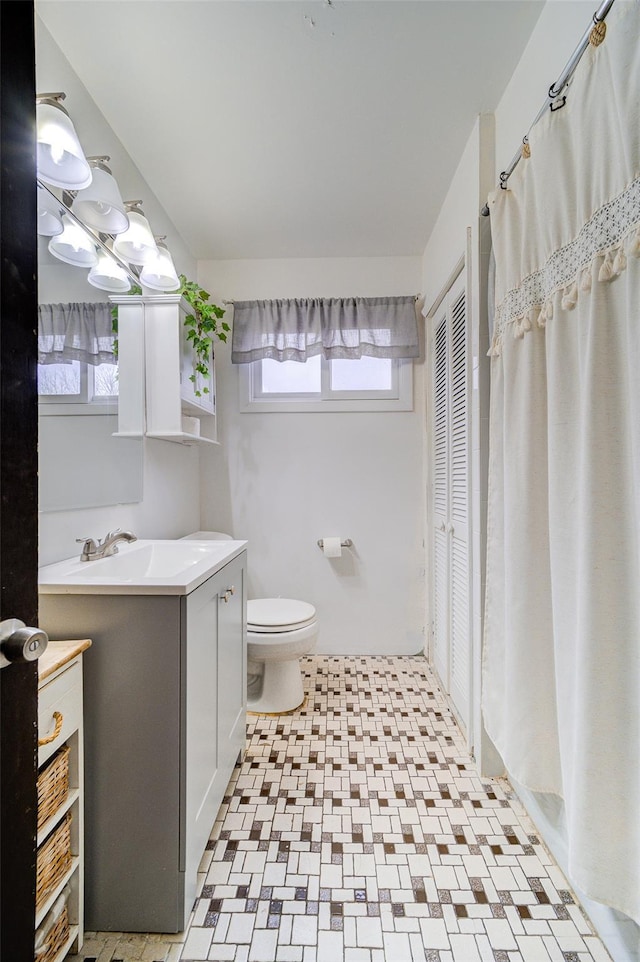 bathroom with vanity and toilet