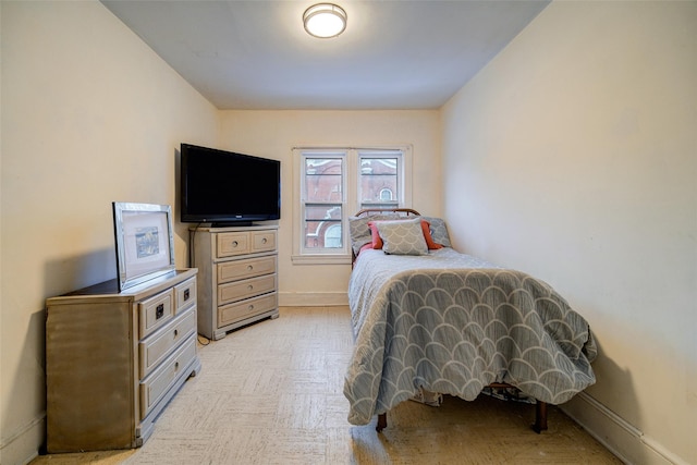 bedroom featuring light parquet floors