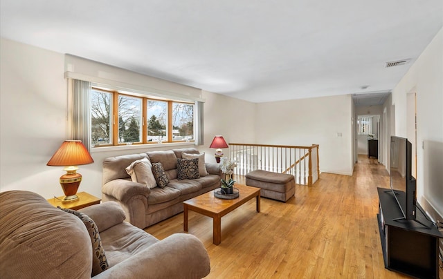 living room with light hardwood / wood-style floors