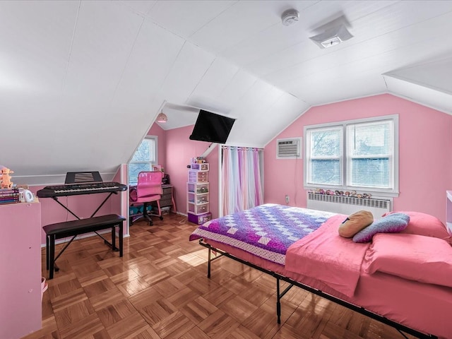 bedroom featuring vaulted ceiling, an AC wall unit, radiator, and parquet flooring