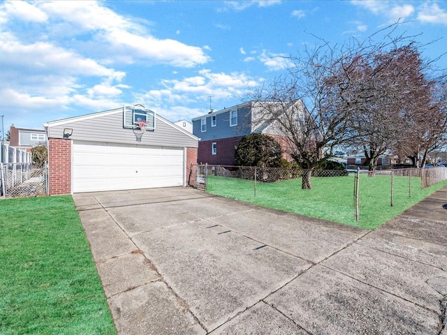 exterior space with a garage, an outdoor structure, and a lawn