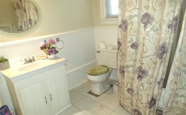 bathroom with vanity, walk in shower, tile patterned floors, and toilet