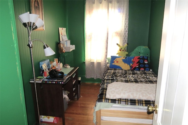 bedroom featuring wood-type flooring