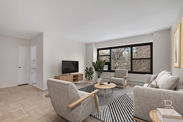 living room featuring light parquet floors and a baseboard heating unit