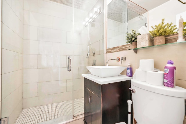 bathroom featuring backsplash, tile walls, vanity, walk in shower, and toilet