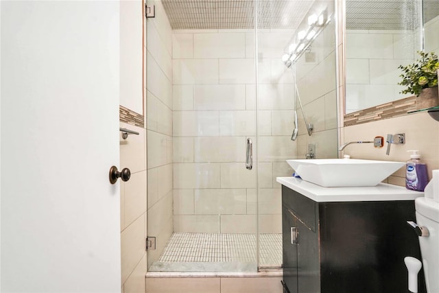 bathroom with vanity and walk in shower