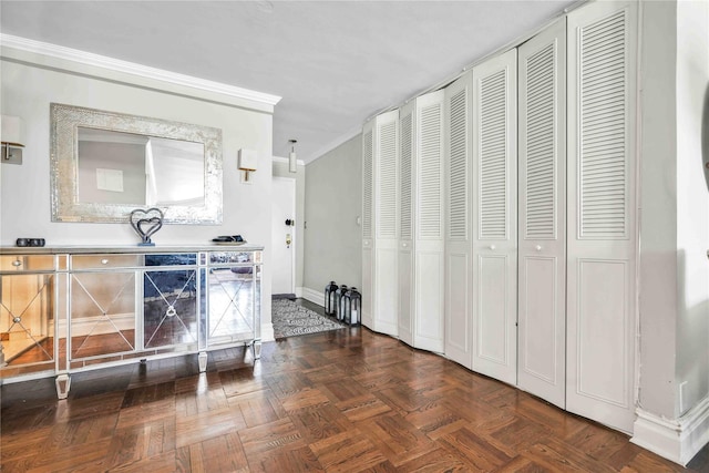 kitchen with crown molding and dark parquet flooring