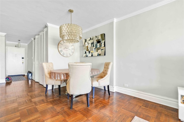 dining room with crown molding, a notable chandelier, and dark parquet floors