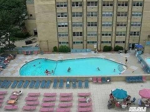 view of swimming pool with a patio