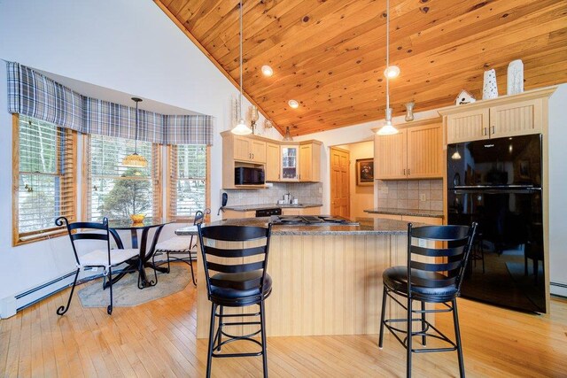 161 Barker Rd, Glen Spey, NY 12737 - kitchen featuring freestanding refrigerator, dark countertops, light wood-style flooring, a breakfast bar area, and wood ceiling