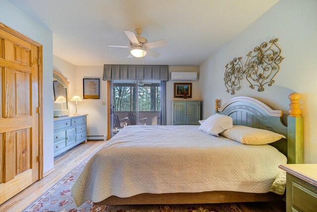 161 Barker Rd, Glen Spey, NY 12737 - bedroom featuring a baseboard radiator, a wall unit AC, wood finished floors, ceiling fan, and access to outside