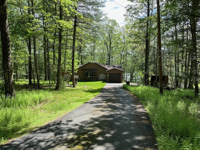 161 Barker Rd, Glen Spey, NY 12737 - view of front facade featuring driveway, a garage, and a wooded view