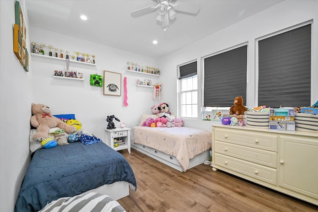 bedroom featuring ceiling fan and light wood-type flooring