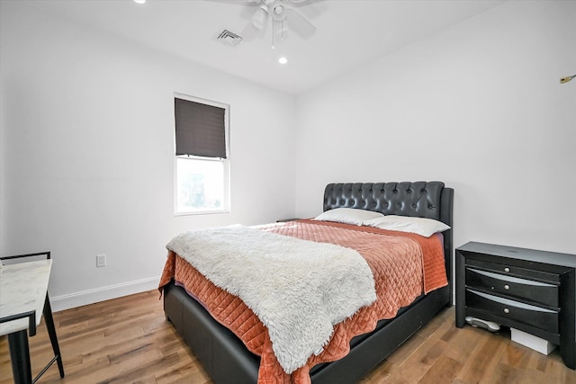 bedroom featuring wood-type flooring and ceiling fan