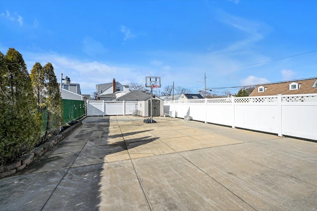 view of patio with a shed