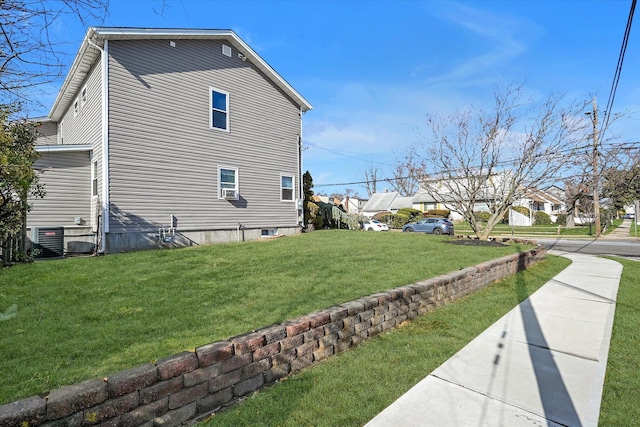 view of property exterior featuring a lawn