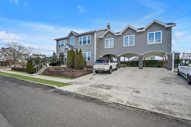 view of front of property featuring a carport