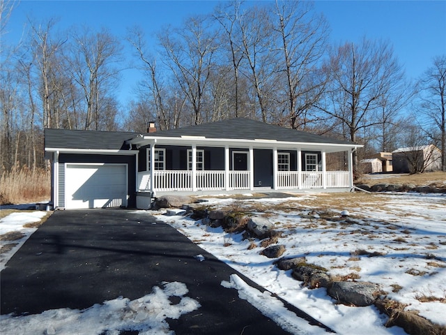 view of front of house featuring a garage and a porch